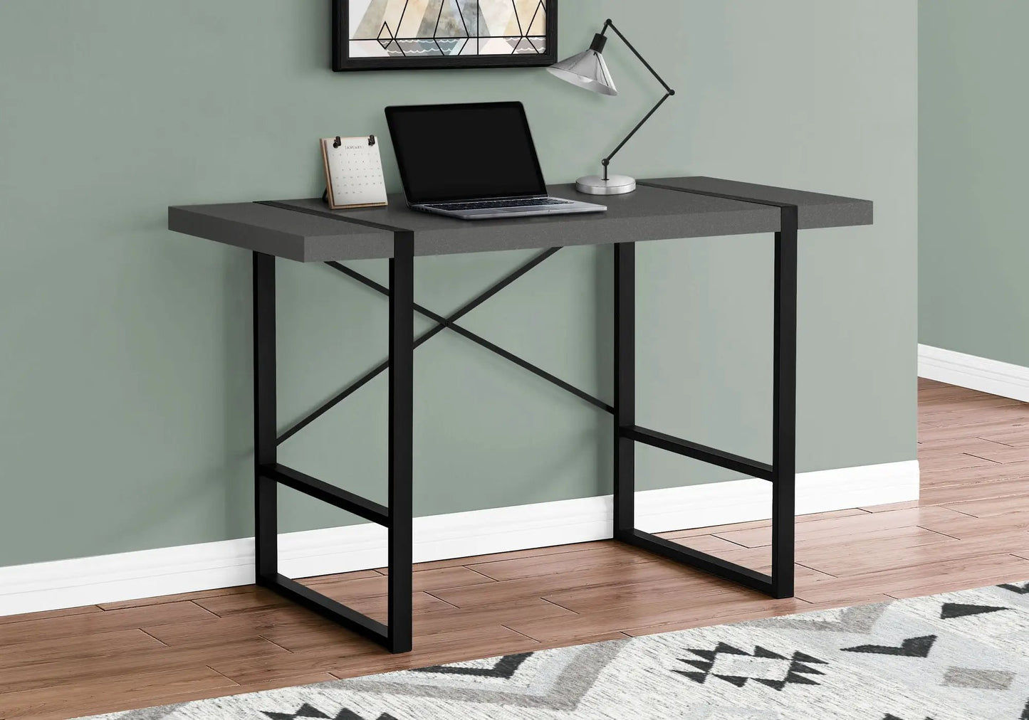 Computer desk for home office in gray with black metal frame and laptop resting on top on Tampa Home & Garden Store