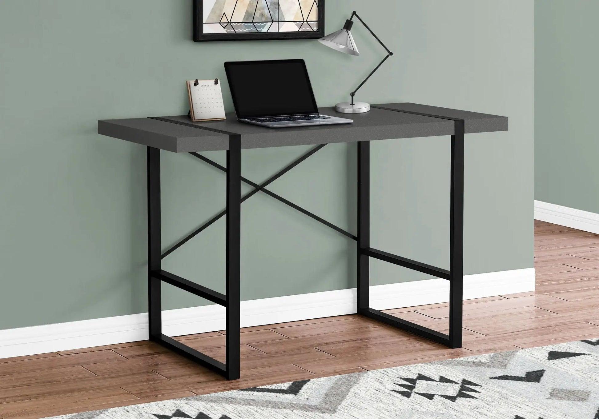 Computer desk for home office in gray with black metal frame and laptop resting on top on Tampa Home & Garden Store
