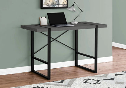 Computer desk for home office in gray with black metal frame and laptop resting on top on Tampa Home & Garden Store