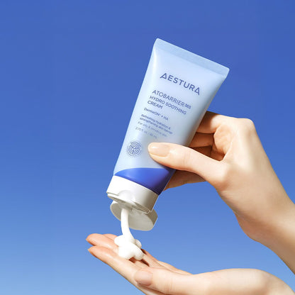AESTURA Atobarrier 365 Hydro Soothing Cream tube blue packaging, cream on hand against blue sky on Tampa Home & Garden Store