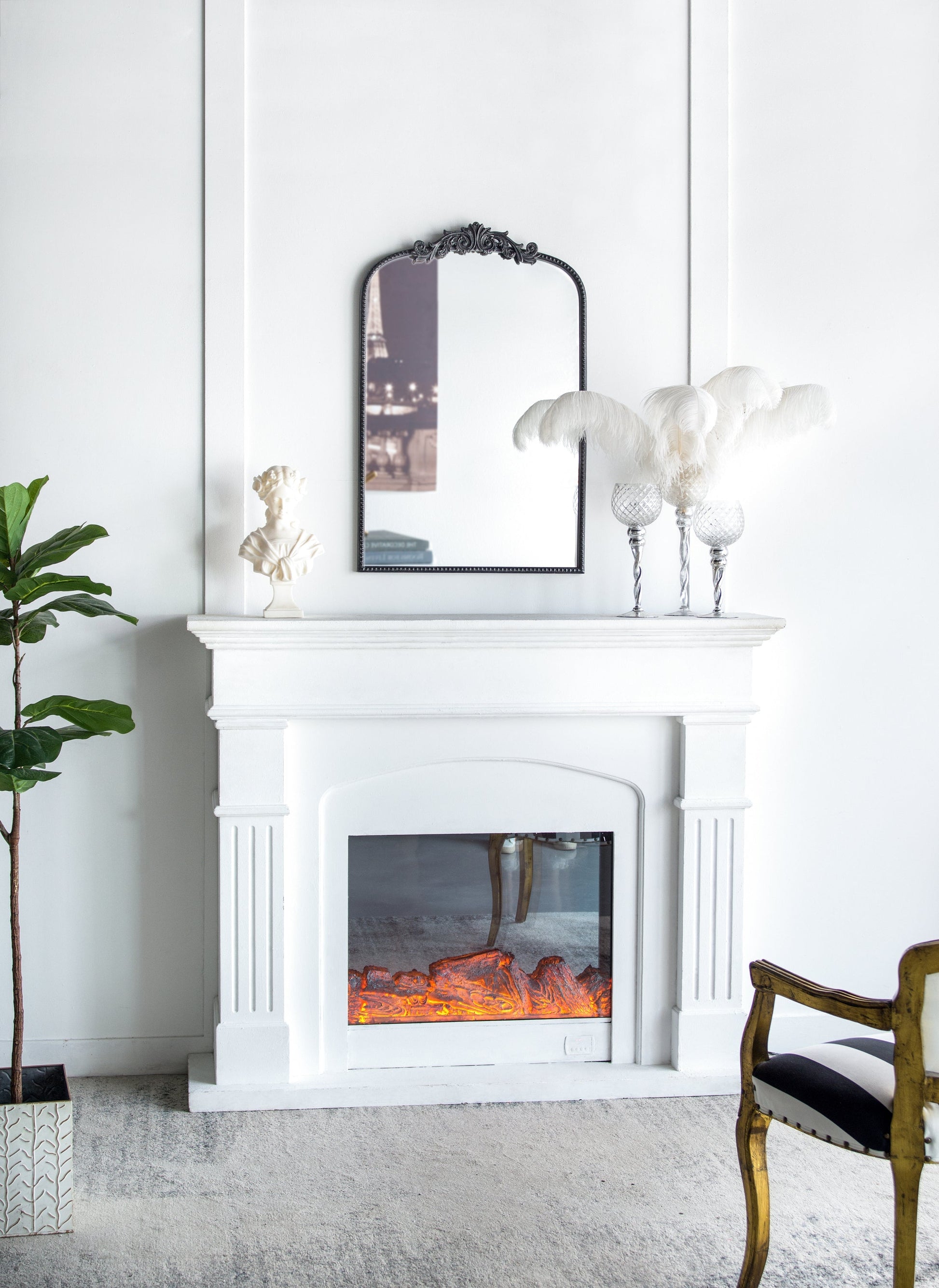 The Baroque Ébonisé Grand Wall Mirror with a dark ornate frame above a white mantel on Tampa Home & Garden Store
