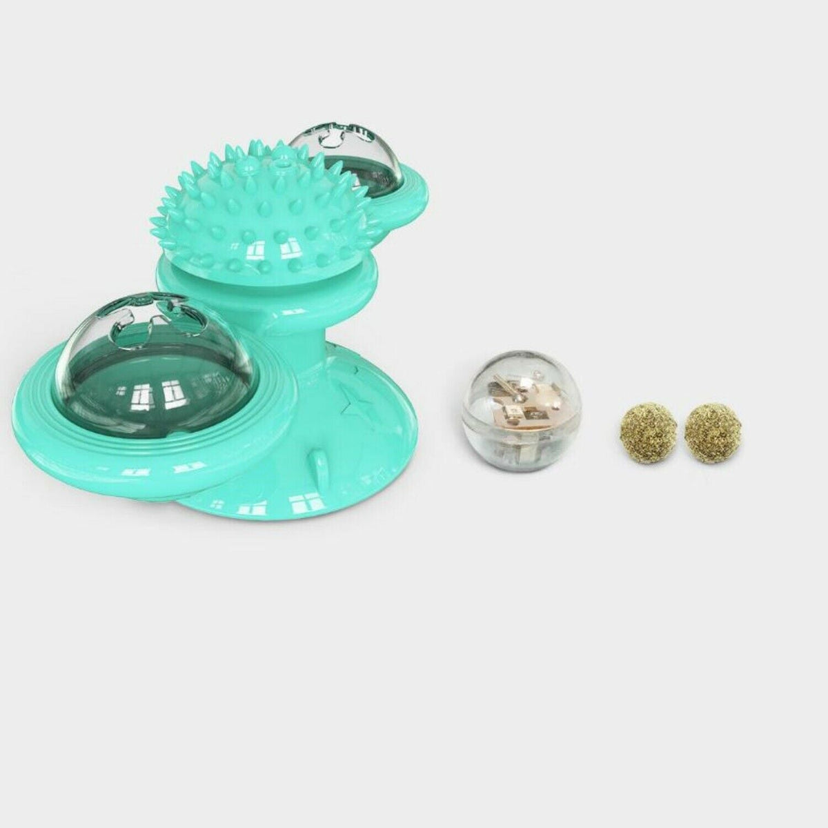 Turquoise windmill cat toy with suction cup and spiked ball, plus two small gold beads on Tampa Home & Garden Store