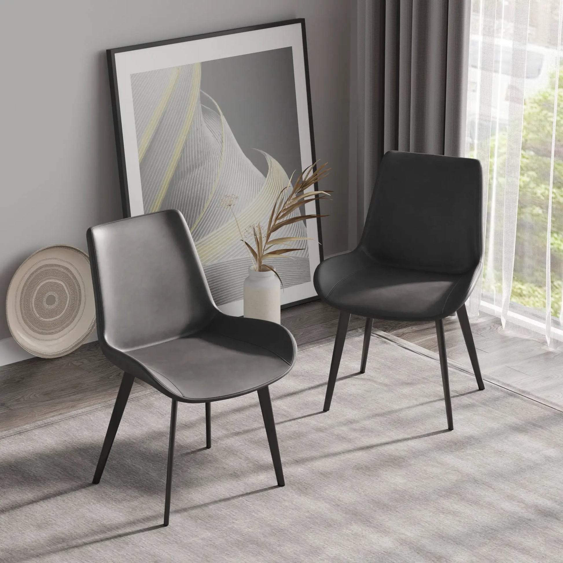 Modern dining chair set in black faux leather with metal legs, 2 chairs for a contemporary dining space on Tampa Home & Garden Store