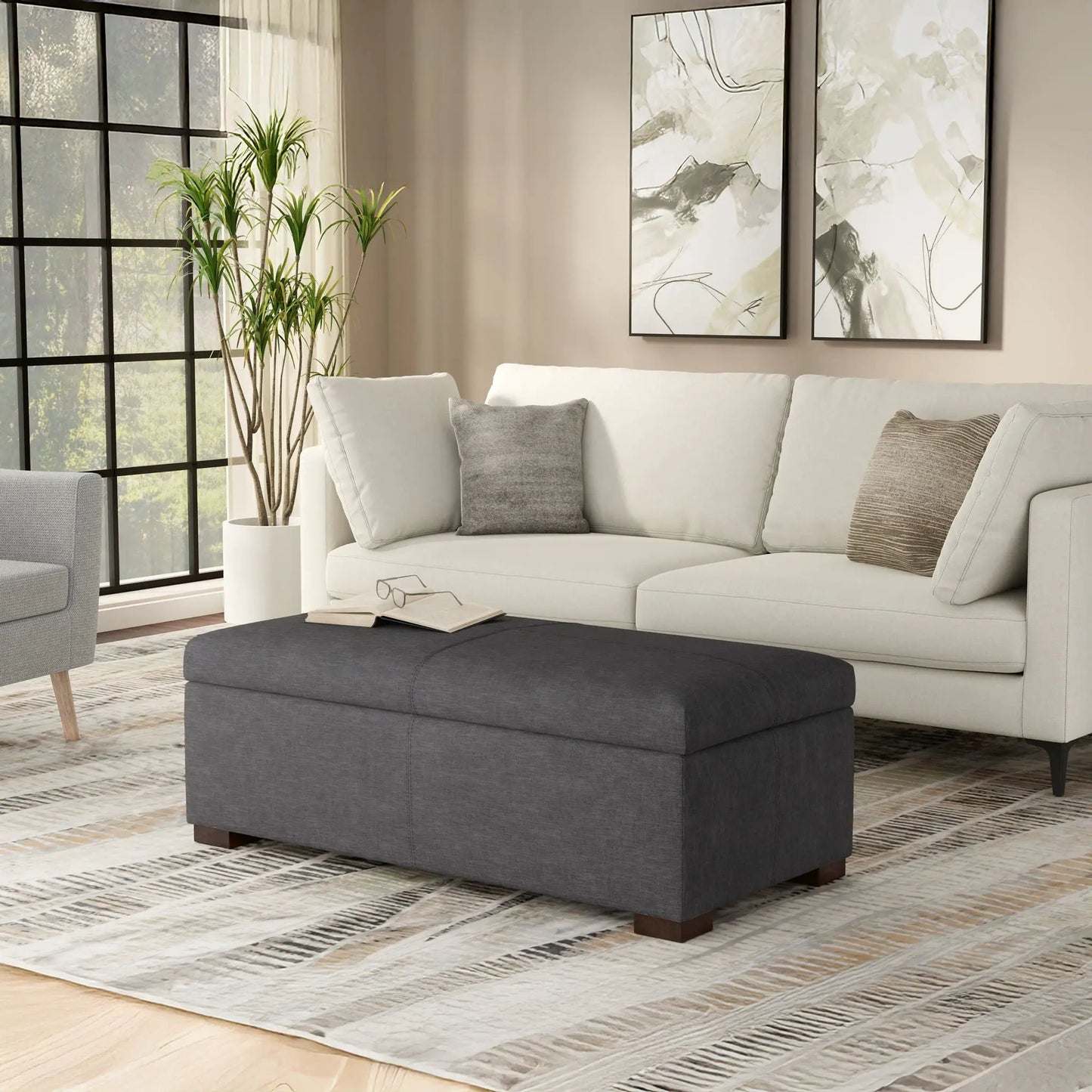 Gabbie storage ottoman by Unique Piece Furniture in charcoal gray upholstery with wooden legs on Tampa Home & Garden Store