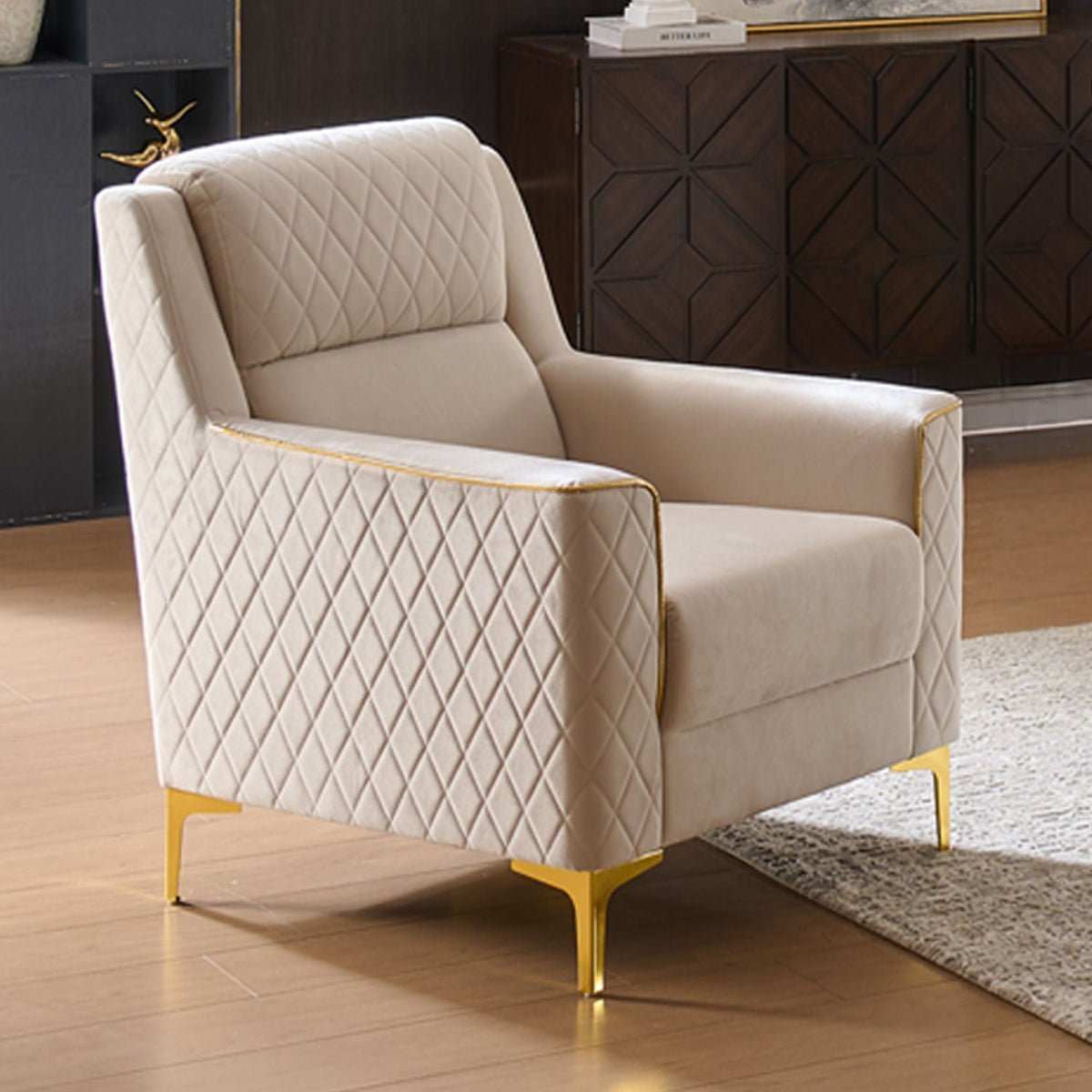 Upholstered living room chair with diamond quilted beige fabric and gold-tone legs on Tampa Home & Garden Store