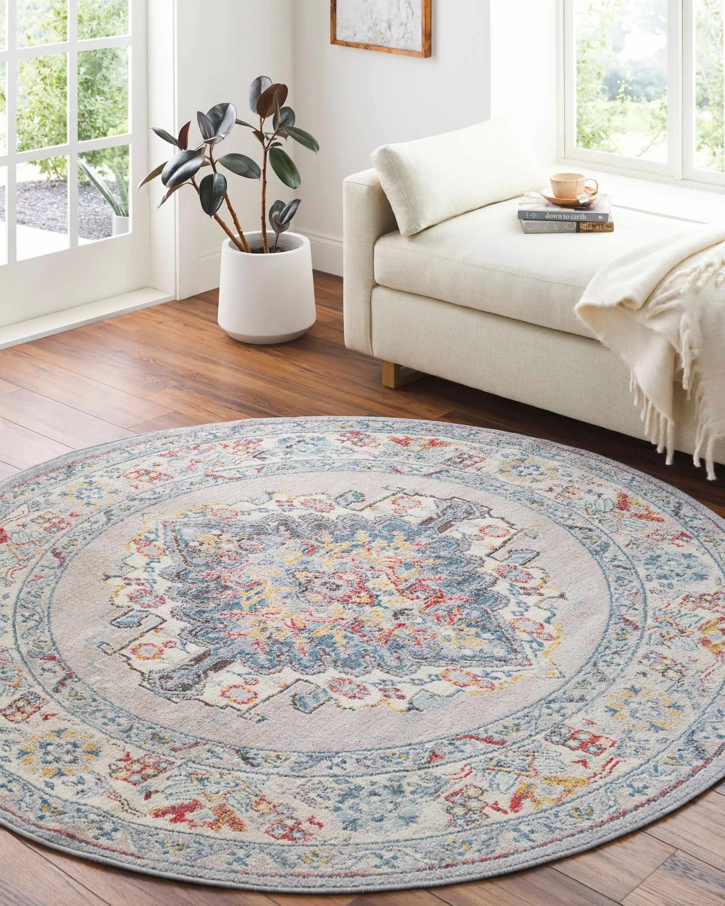 Haymond Area Rug, round floral pattern in blue and ivory with multicolor accents on Tampa Home & Garden Store