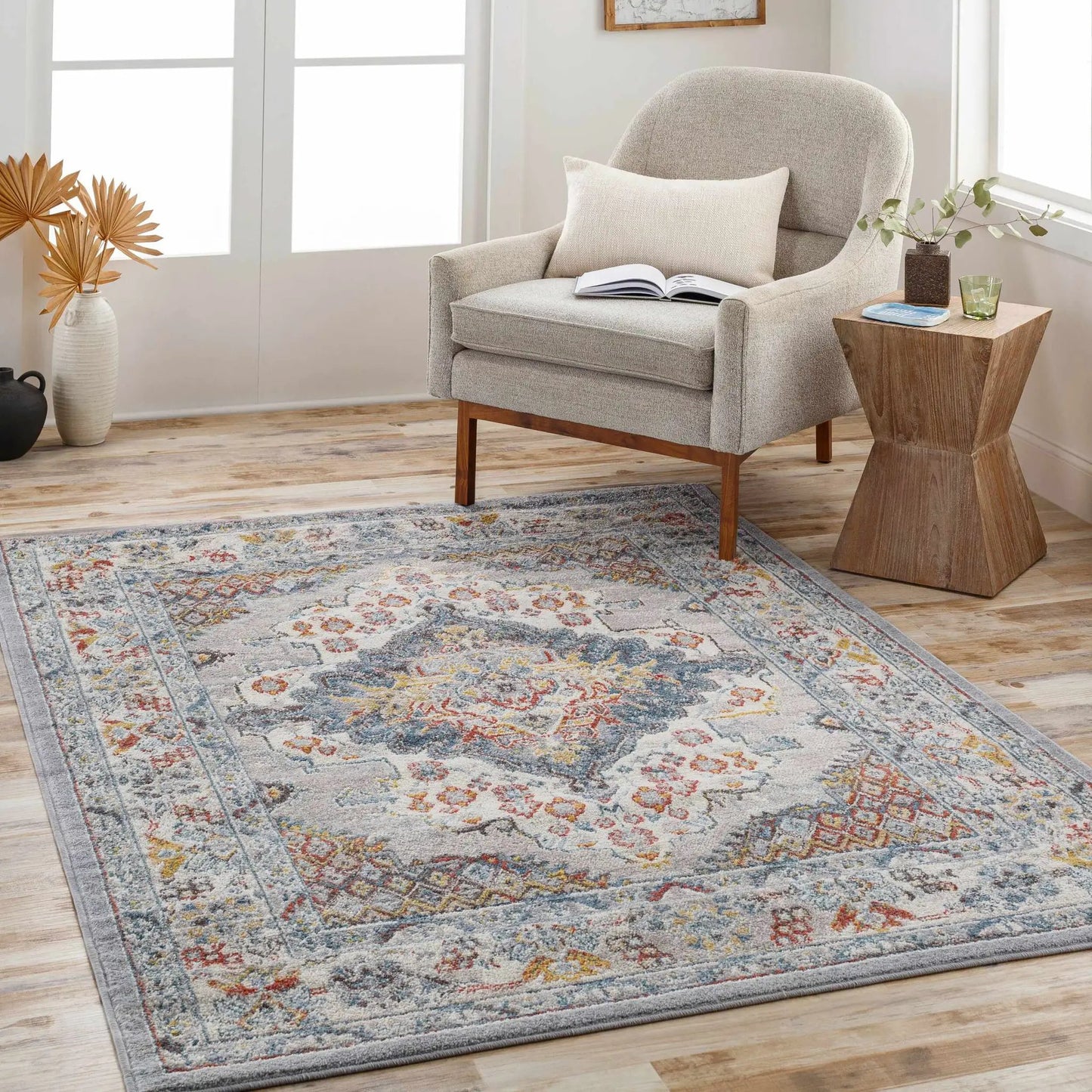 Haymond Area Rug by Boutique Rugs with soft gray base and multicolor floral accents on Tampa Home & Garden Store