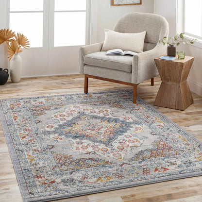 Haymond Area Rug by Boutique Rugs with soft gray base and multicolor floral accents on Tampa Home & Garden Store