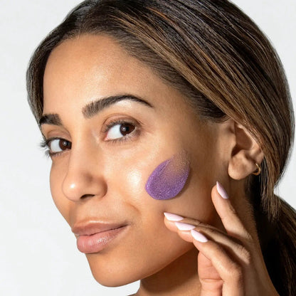 Alastin Skincare ReSURFACE Skin Polish exfoliating cleanser on cheek with purple texture on Tampa Home & Garden Store
