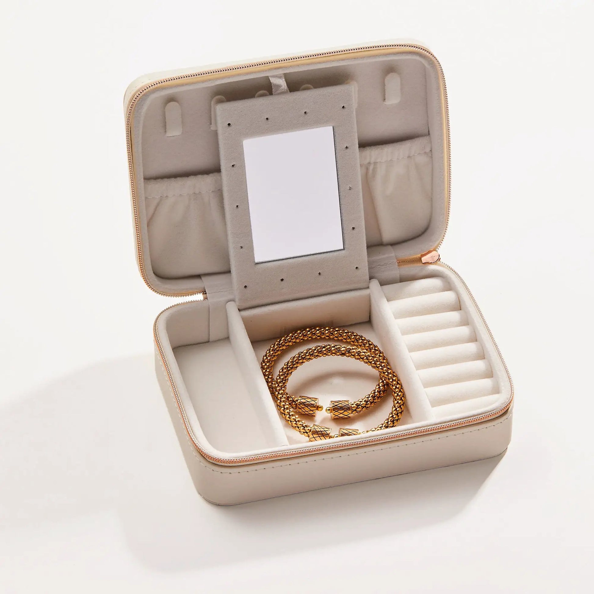 Symbols Jewelry Case with beige velvet and gold chain inside on Tampa Home & Garden Store