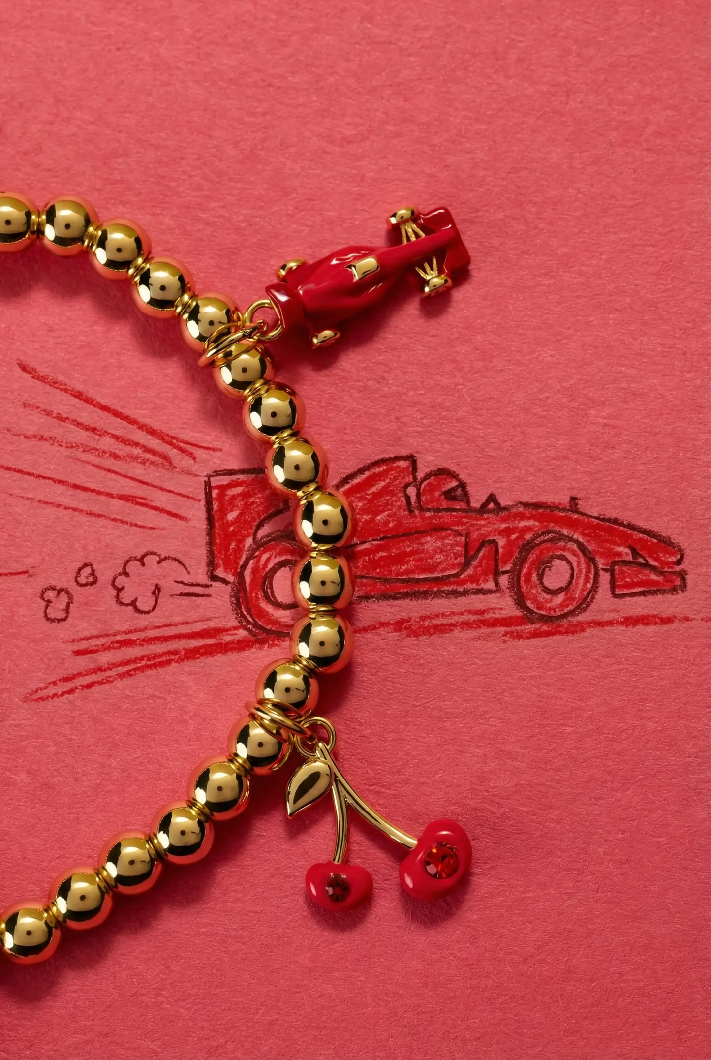 Crayola Fan Favorites Scarlet Charm Stretch Bracelet red charm with gold-tone beads on Tampa Home & Garden Store