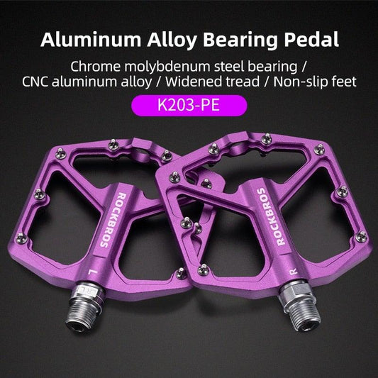 Purple aluminum bicycle pedals, flat anti-slip platform, RockBros branding, sealed bearings on Tampa Home & Garden Store