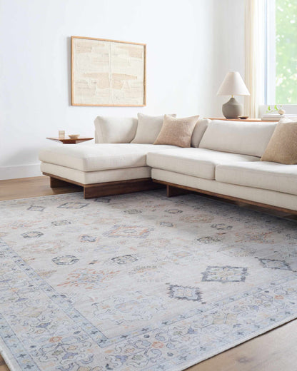 Beige Beckett washable rug in a light neutral palette with blue accents Boutique Rugs on Tampa Home & Garden Store