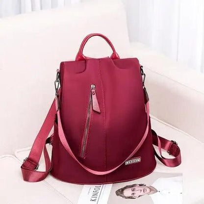 Amaznig anti-theft backpack in burgundy fabric with top handle and Stevvex laptop backpack on Tampa Home & Garden Store