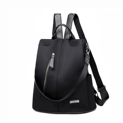 Stevvex black anti-theft backpack in waterproof fabric with front zipper pocket and top handle on Tampa Home & Garden Store