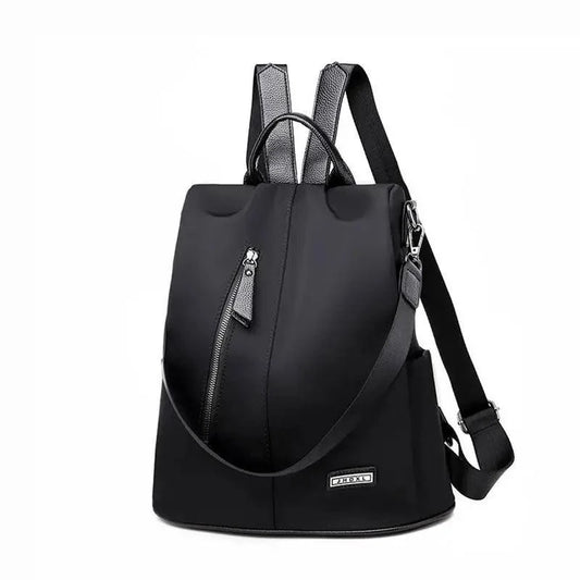 Stevvex black anti-theft backpack in waterproof fabric with front zipper pocket and top handle on Tampa Home & Garden Store