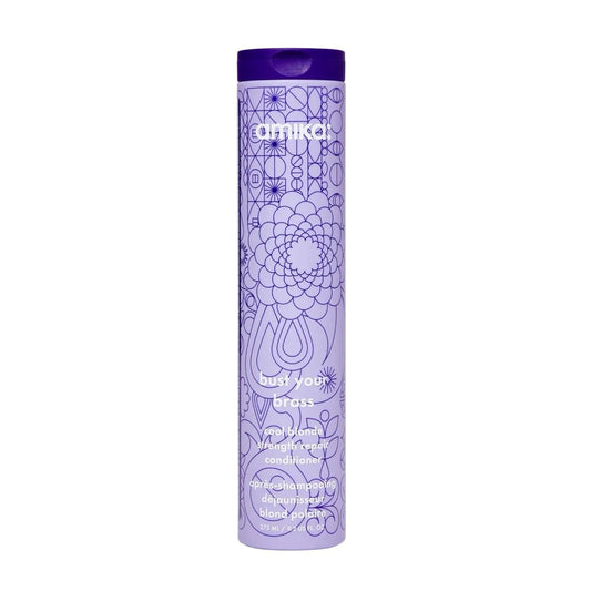 Amika Bust Your Brass Blonde Strength Repair Conditioner bottle with purple logo Tampa on Tampa Home & Garden Store
