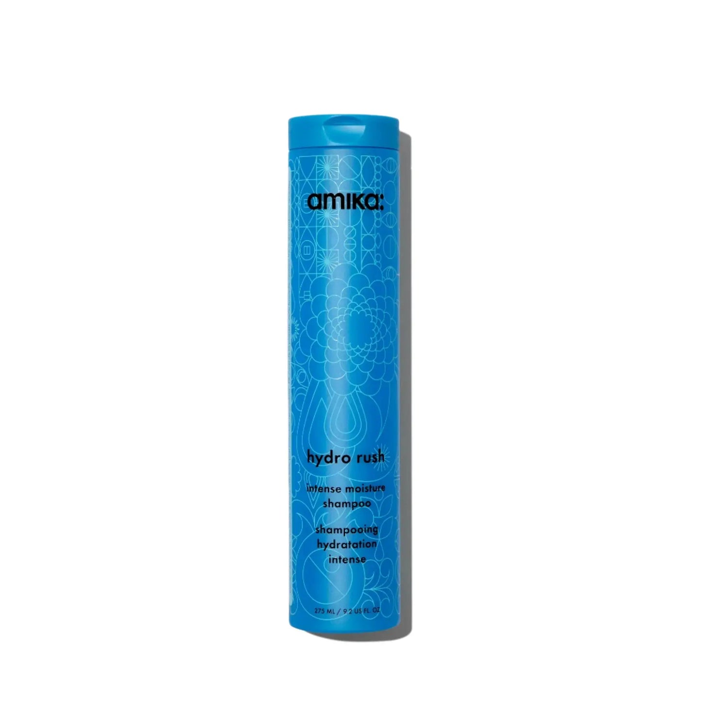 Amika Hydro Rush Intense Moisture Shampoo bottle in blue with geometric patterns on Tampa Home & Garden Store