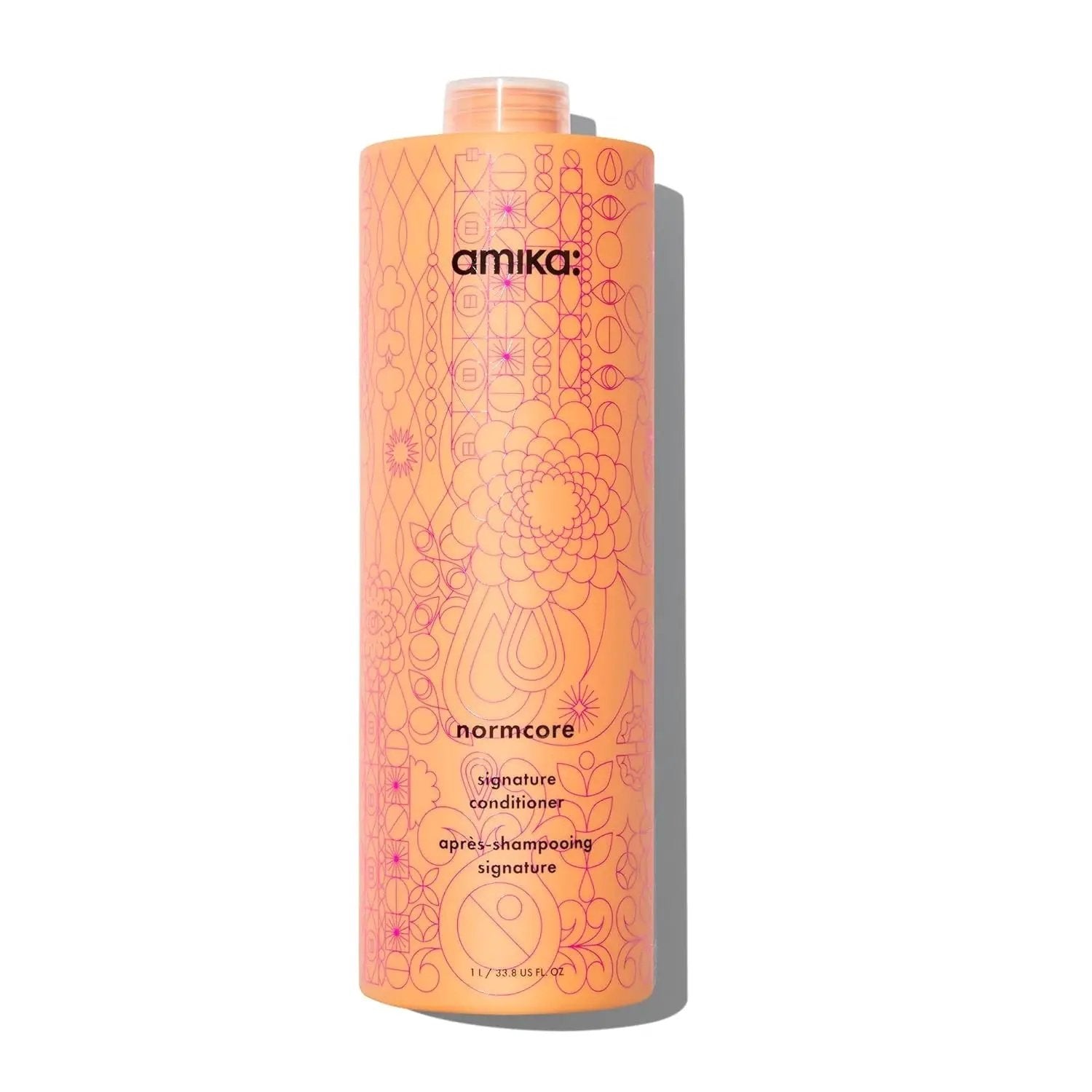 Amika Normcore Hydrating Conditioner bottle in peach-orange plastic with pink geometric pattern on Tampa Home & Garden Store
