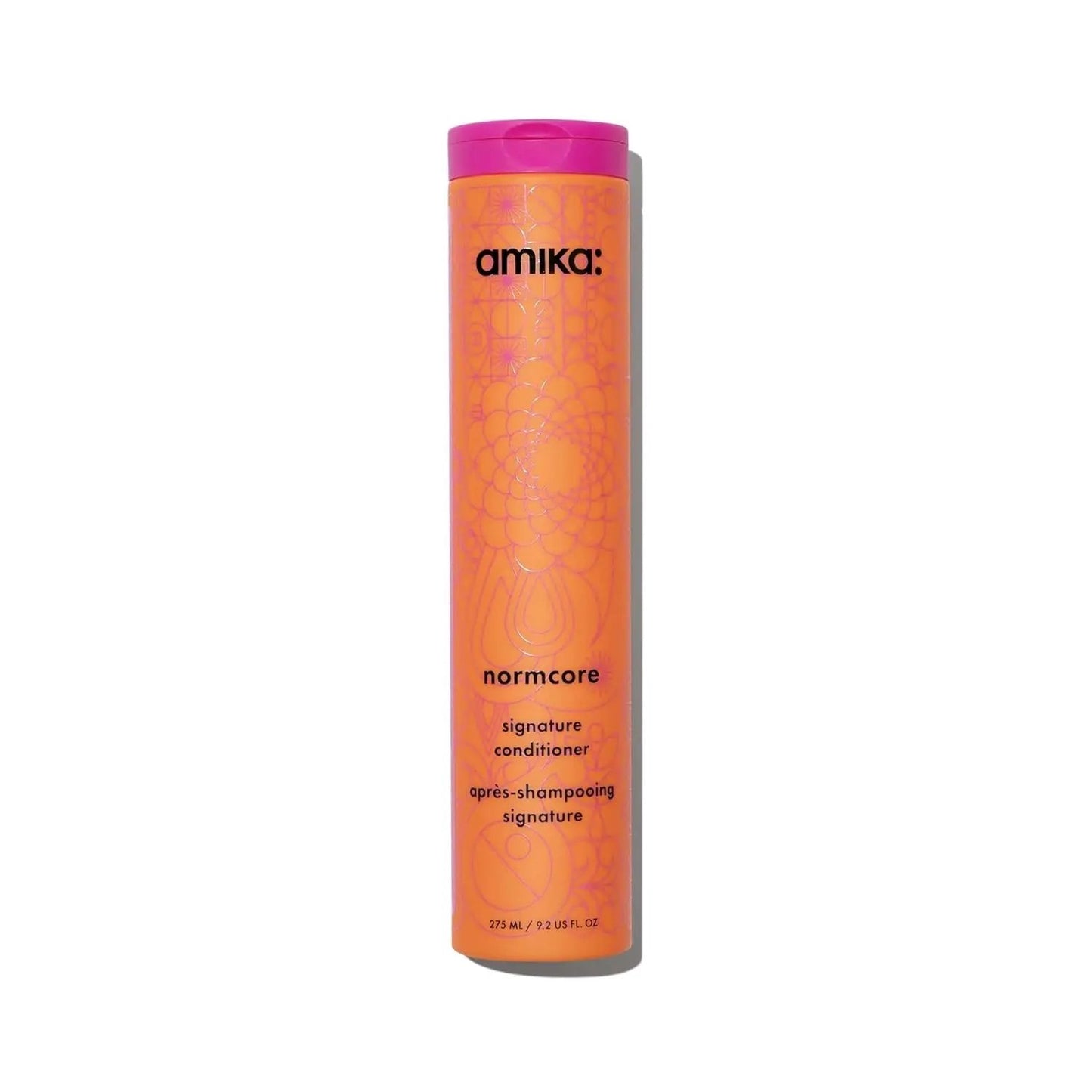 Amika Normcore Hydrating Conditioner bottle, orange body with pink cap on Tampa Home & Garden Store