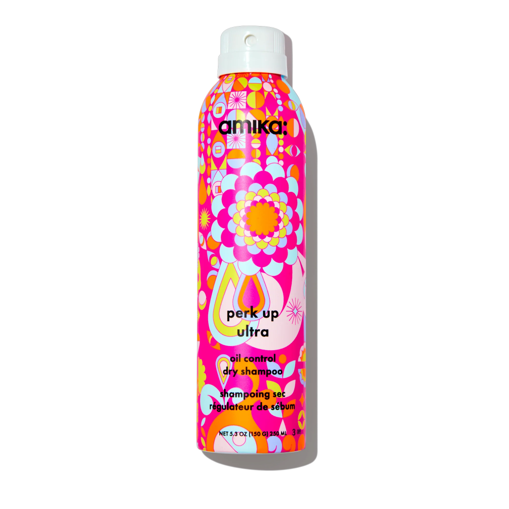 Amika Perk Up Ultra Oil Control Dry Shampoo bottle in pink psychedelic print with white cap on Tampa Home & Garden Store