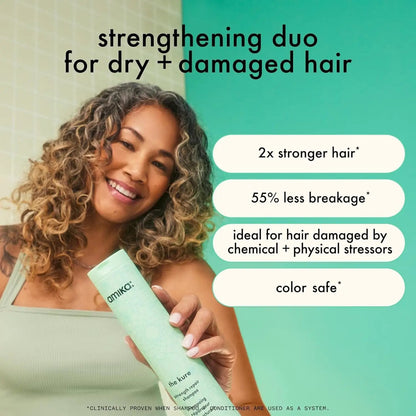 Amika The Kure Strength Repair Conditioner mint green bottle held by a woman with curly hair on Tampa Home & Garden Store