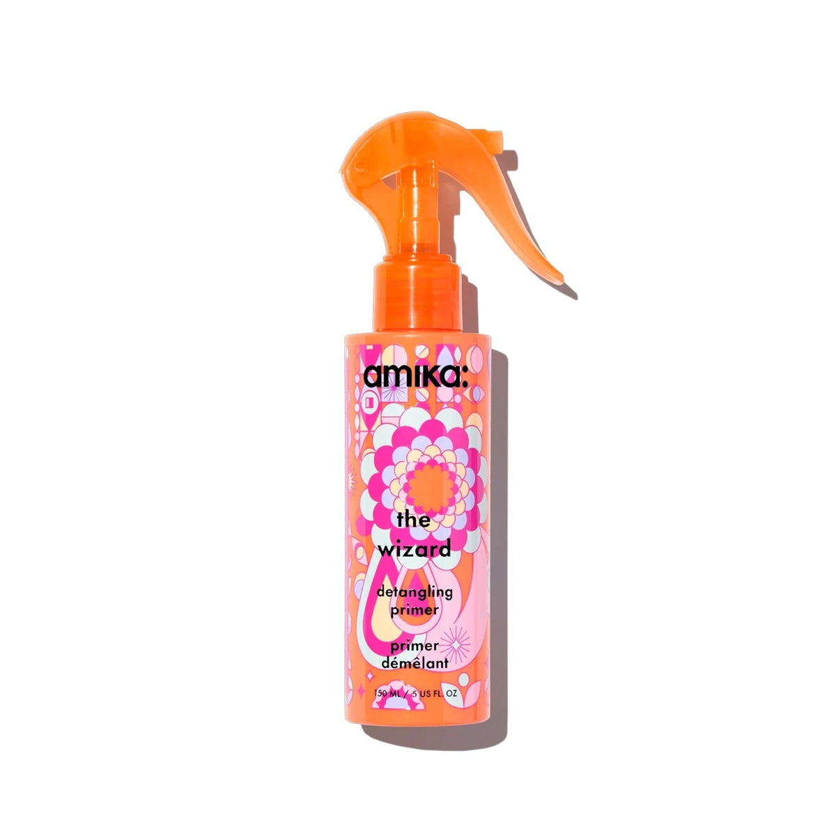 Amika The Wizard Detangling Primer spray bottle with orange nozzle and pink floral pattern on Tampa Home & Garden Store