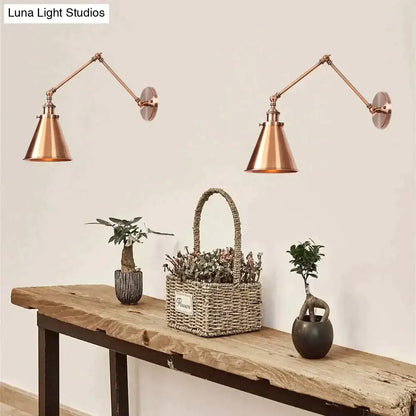 Adjustable wall lamp pair in copper finish with articulated arms on Tampa Home & Garden Store
