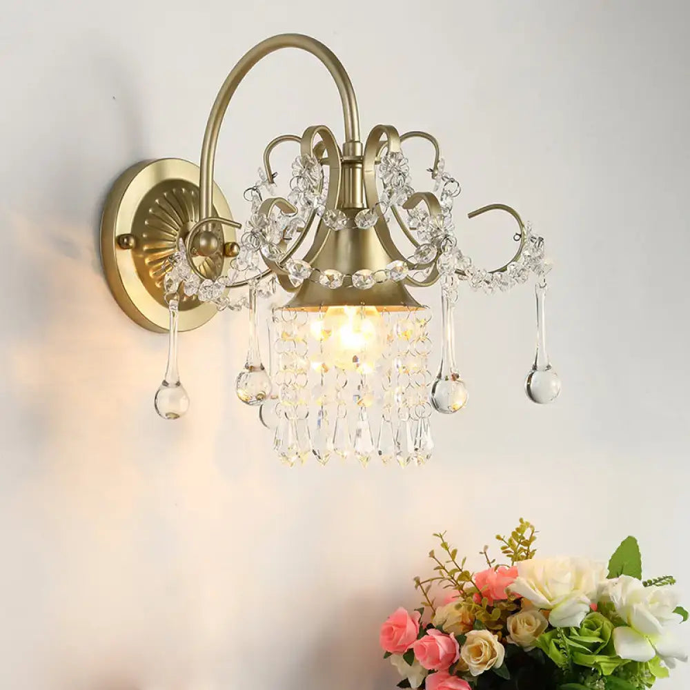 Brass Crystal Living Area Wall Sconce by Decorbites with curved arms and hanging prisms on Tampa Home & Garden Store