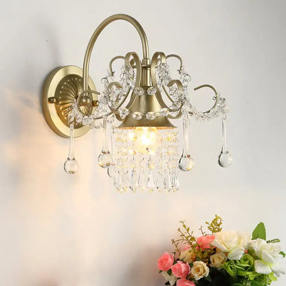 Brass Crystal Living Area Wall Sconce by Decorbites with curved arms and hanging prisms on Tampa Home & Garden Store