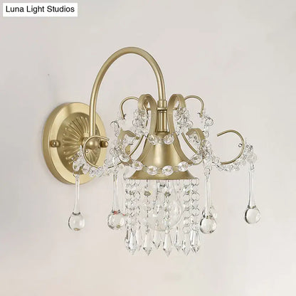 Brass crystal living area wall sconce by Decorbites with hanging crystal prisms on Tampa Home & Garden Store