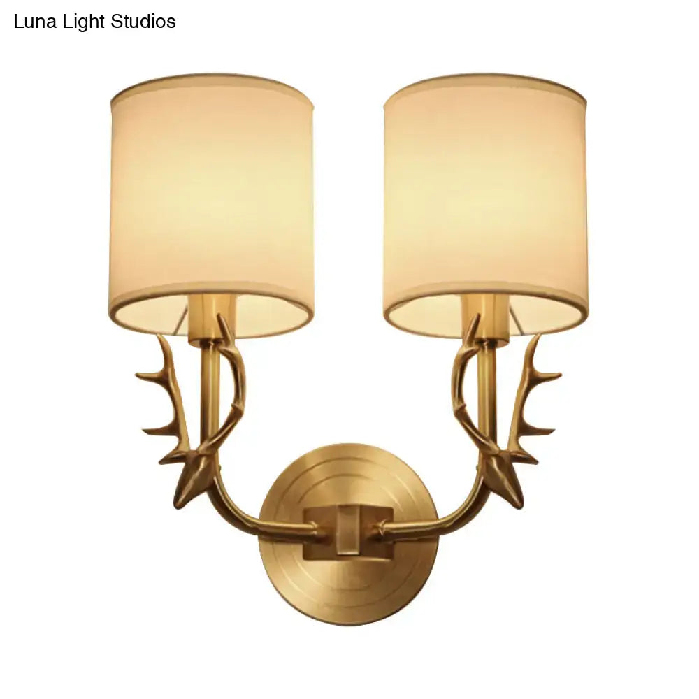 Antique Brass Fabric Sconce by Decorbites with dual antler-inspired arms and fabric shades on Tampa Home & Garden Store