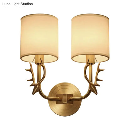 Antique Brass Fabric Sconce by Decorbites with dual antler-inspired arms and fabric shades on Tampa Home & Garden Store