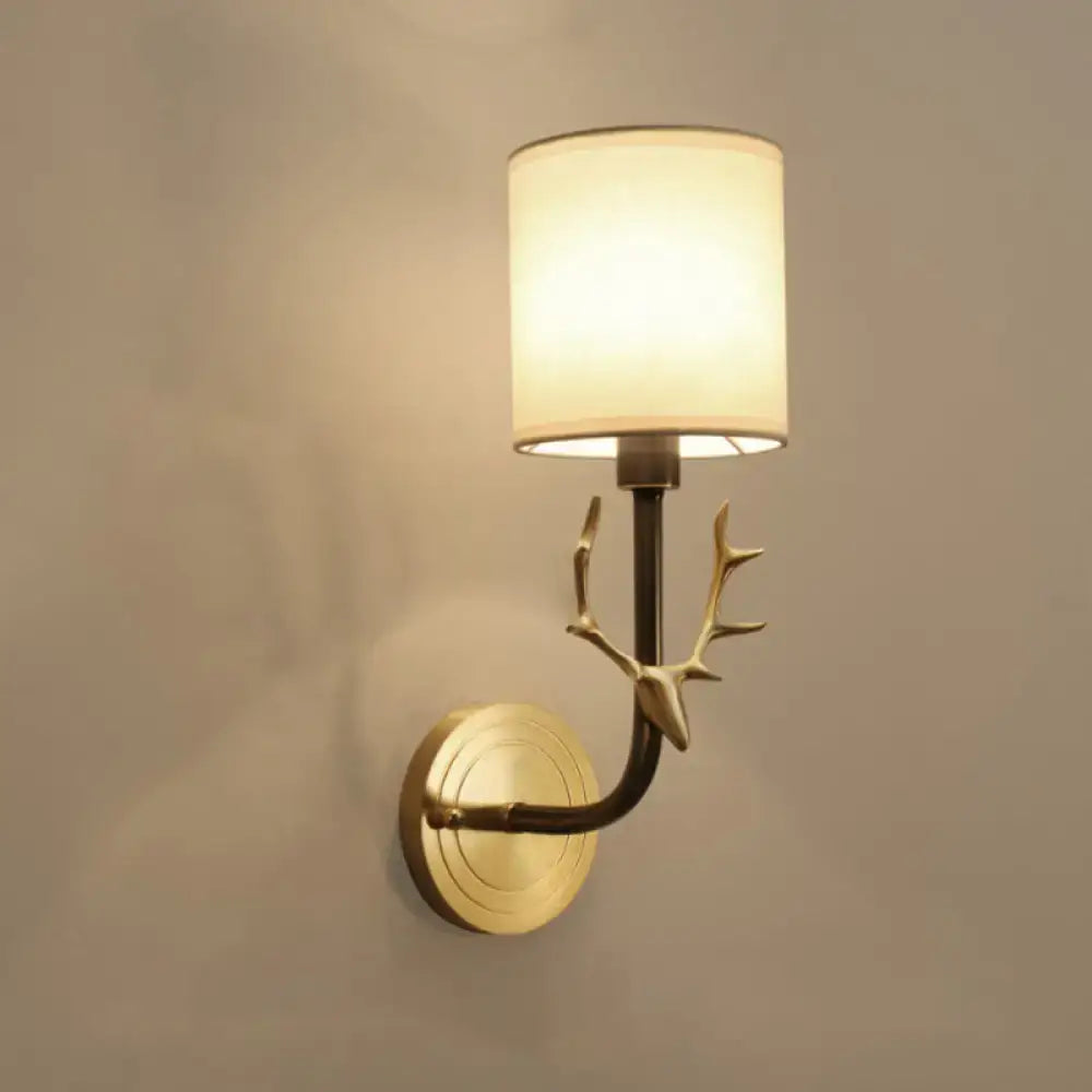 Antique Brass Fabric Sconce by Decorbites, wall-mounted with deer-antler accents and shade on Tampa Home & Garden Store