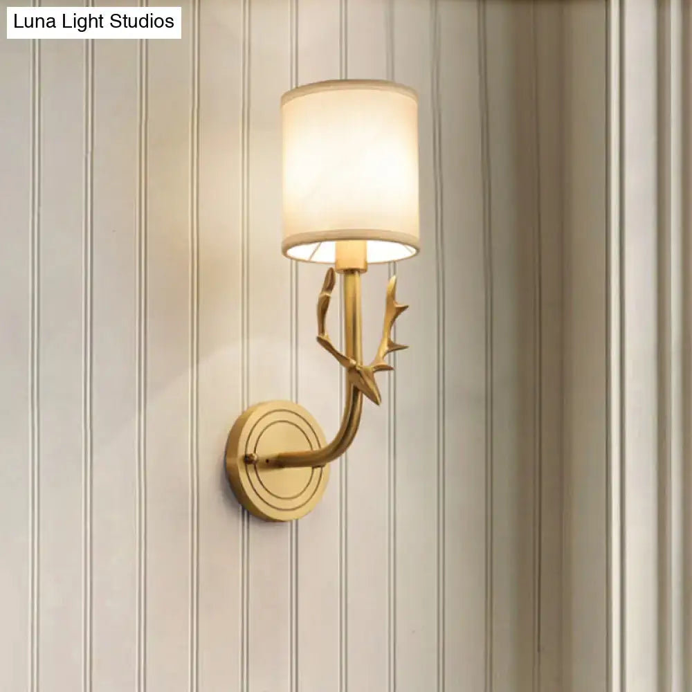 Antique brass fabric sconce by Decorbites with antler branch, cylindrical shade, wall mount on Tampa Home & Garden Store
