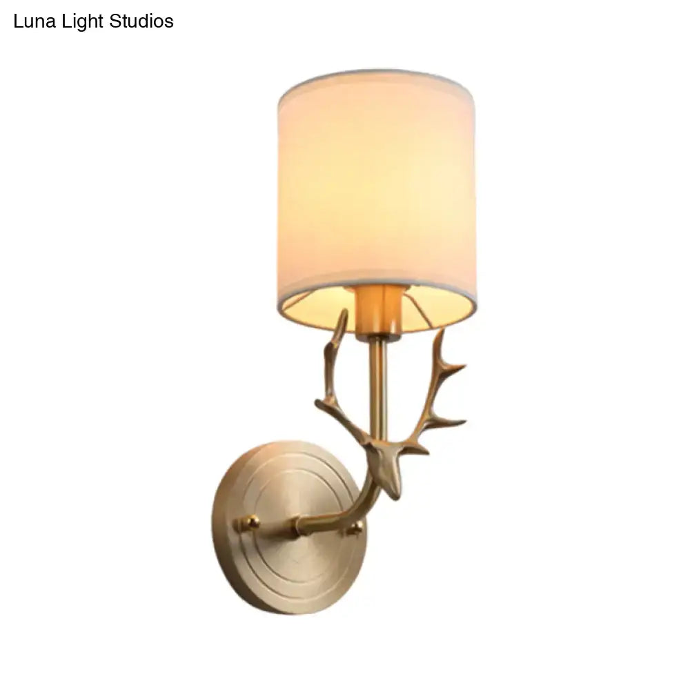 Antique Brass Fabric Sconce by Decorbites with antler-style brass arm and cream shade on Tampa Home & Garden Store