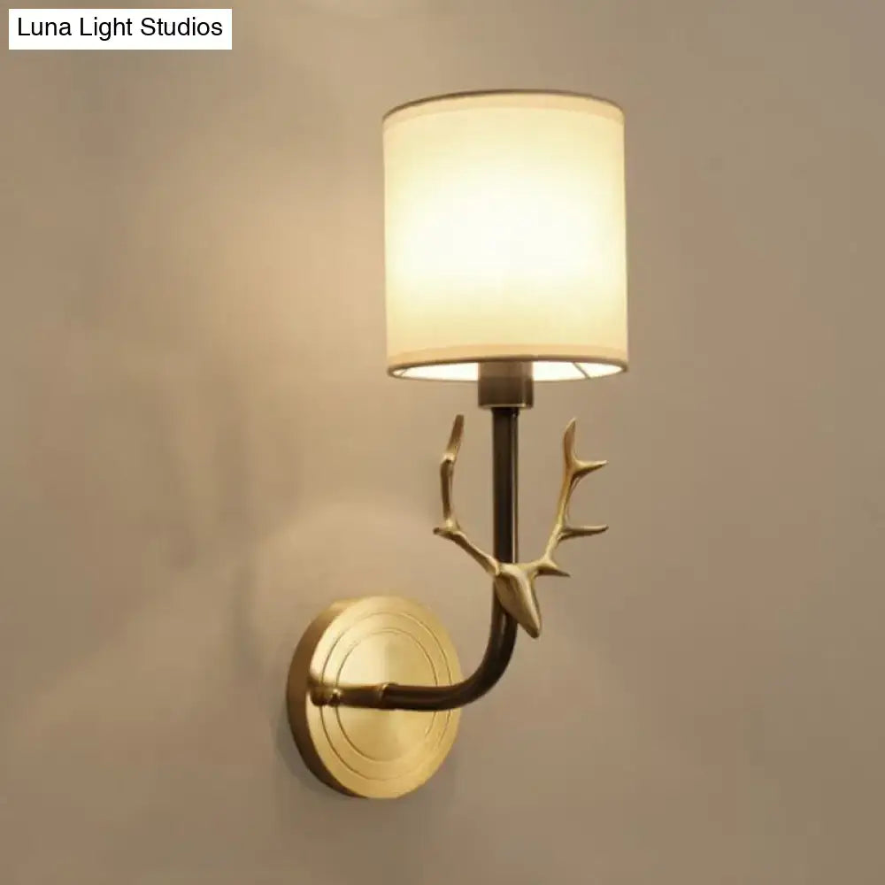 Antique brass fabric sconce with deer antler arm and cream shade Decorbites on Tampa Home & Garden Store