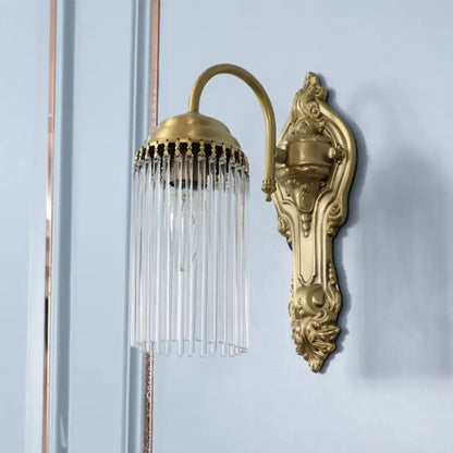 Brass Crystal Rod Sconce with ornate backplate and crystal prisms by Decorbites on Tampa Home & Garden Store
