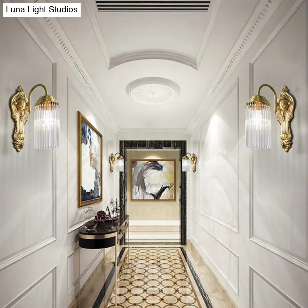 Pair of brass crystal rod sconces with ornate gold backplates and hanging prisms on Tampa Home & Garden Store