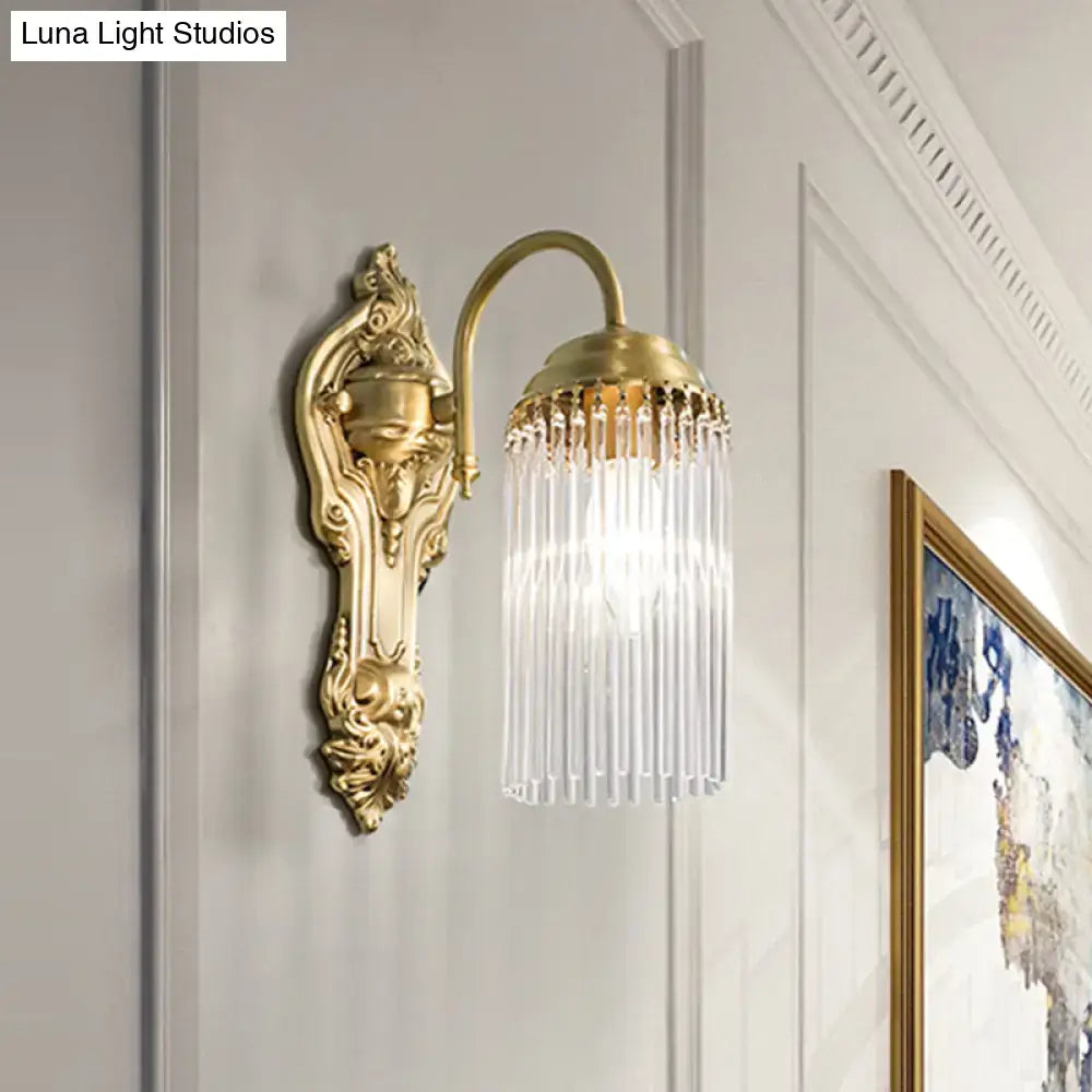 Brass Crystal Rod Sconce by Decorbites with curved arm and crystal fringe shade on wall on Tampa Home & Garden Store
