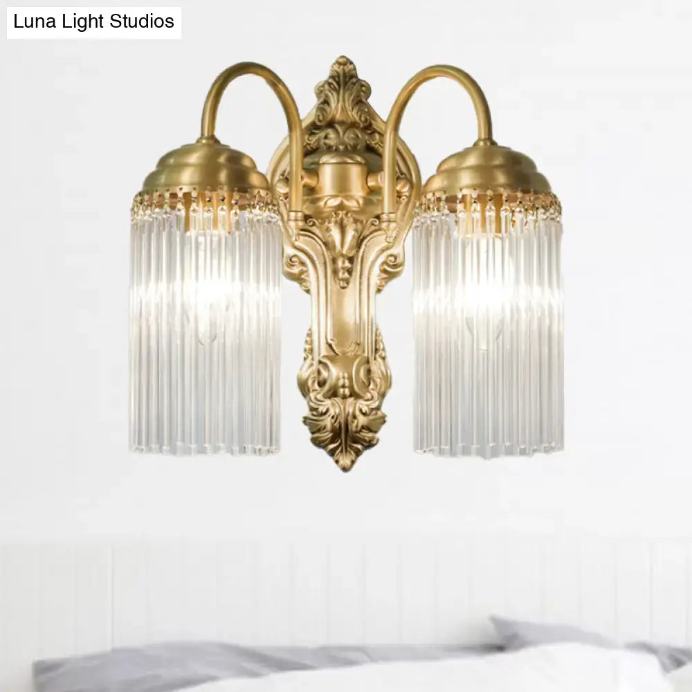 Brass crystal rod sconce by Decorbites with two arms and crystal shade prisms on backplate on Tampa Home & Garden Store