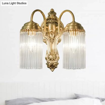 Brass crystal rod sconce by Decorbites with two arms and crystal shade prisms on backplate on Tampa Home & Garden Store