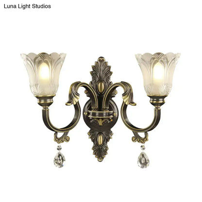 Brass floral black gold wall sconce by Decorbites with crystal drops and twin glass shades on Tampa Home & Garden Store