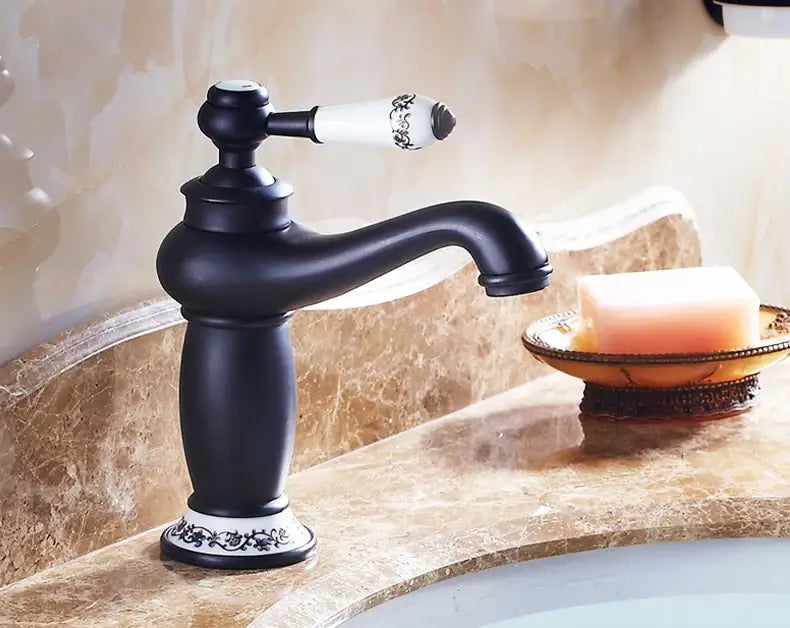 Bronze ceramic handle bathroom faucet by Decorbites, black body with white ornate lever on Tampa Home & Garden Store
