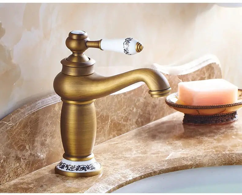 Bronze ceramic handle bathroom faucet Decorbites with white patterned lever on marble sink on Tampa Home & Garden Store