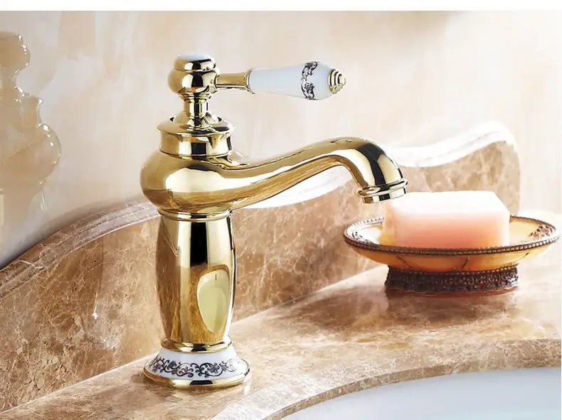 Bronze ceramic handle bathroom faucet Decorbites with goldtone finish on marble vanity on Tampa Home & Garden Store