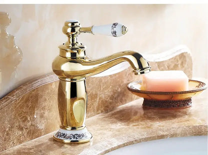 Bronze ceramic handle bathroom faucet Decorbites with goldtone finish on marble vanity on Tampa Home & Garden Store