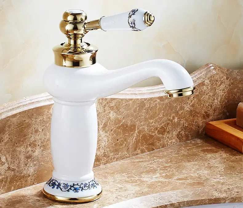 Bronze-accent ceramic handle bathroom faucet by Decorbites, white fixture with blue floral base on Tampa Home & Garden Store