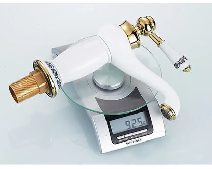 Bronze ceramic handle bathroom faucet Decorbites; white lever with gold accents on scale on Tampa Home & Garden Store