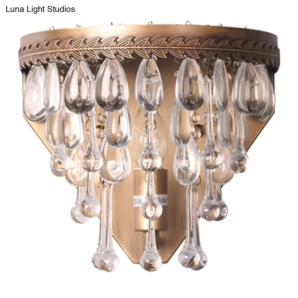 Bronze crystal teardrop wall sconce with hanging prisms by Decorbites on Tampa Home & Garden Store